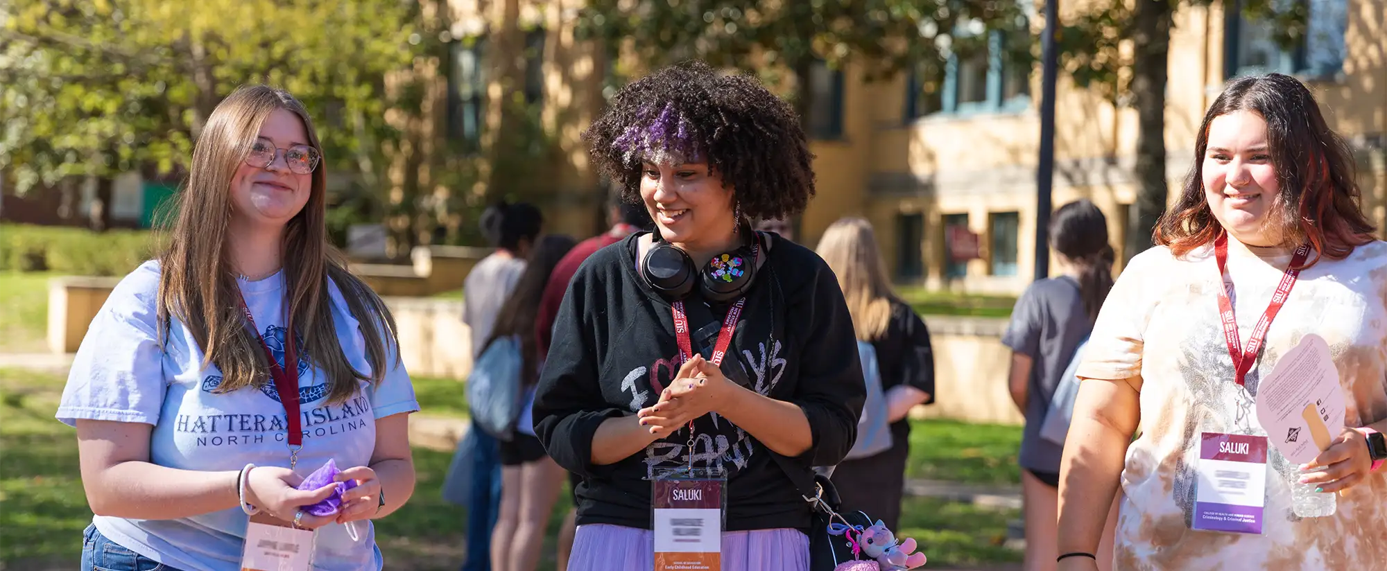 three students on campus