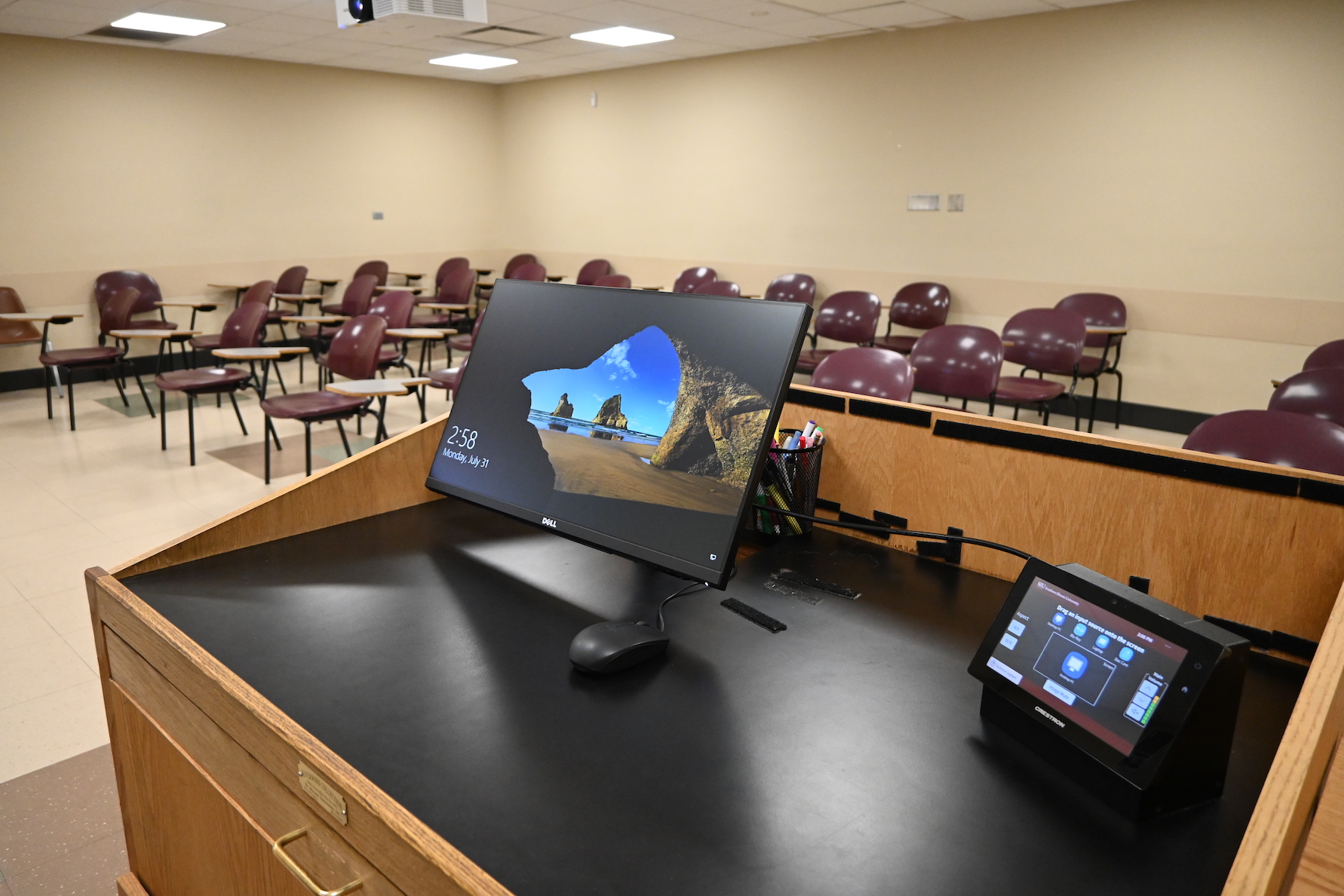 Showing computer with lecture capture on podium in "Advanced Classrooms"