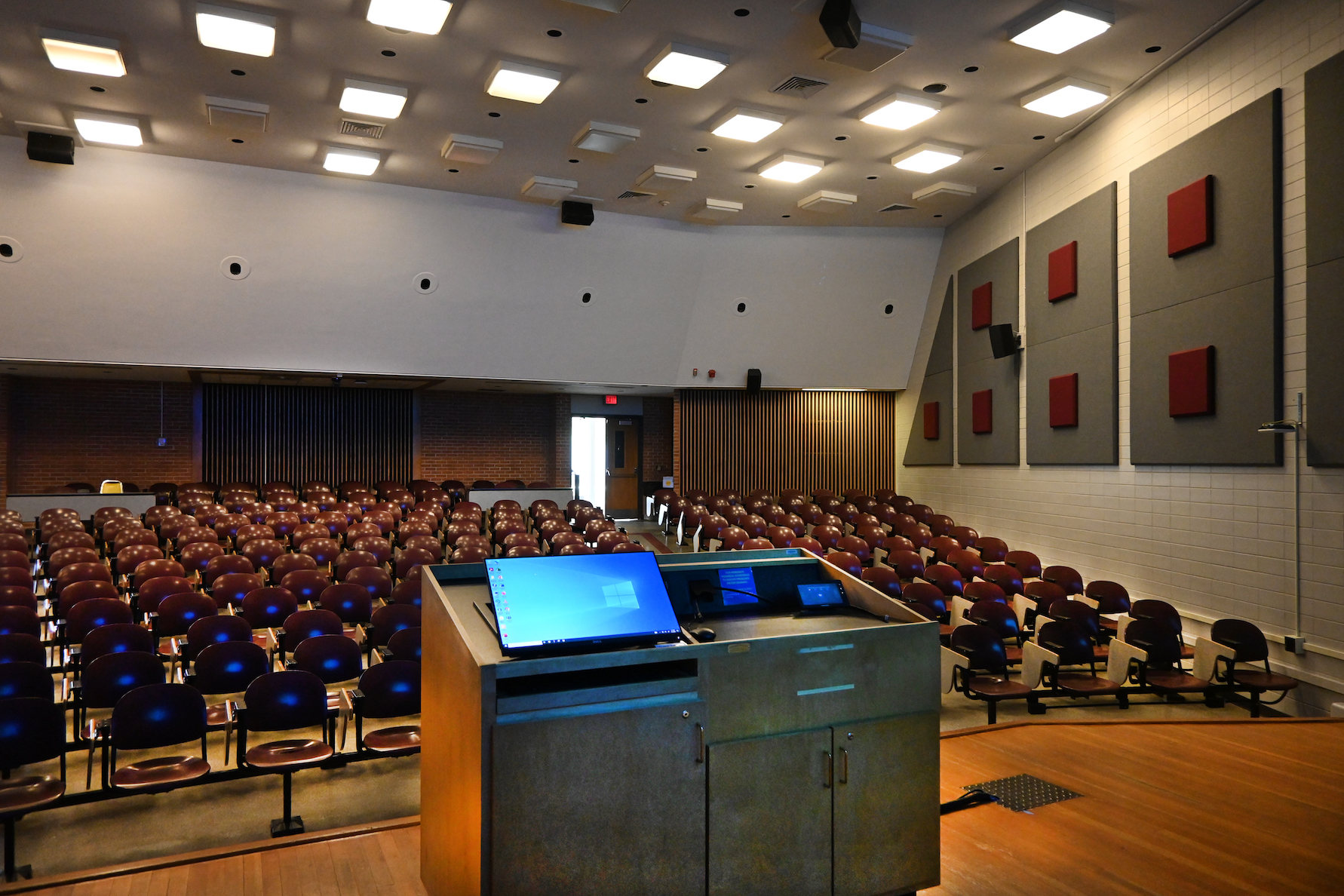 Image showing entire podiu with empty auditorium classroom facing podium.