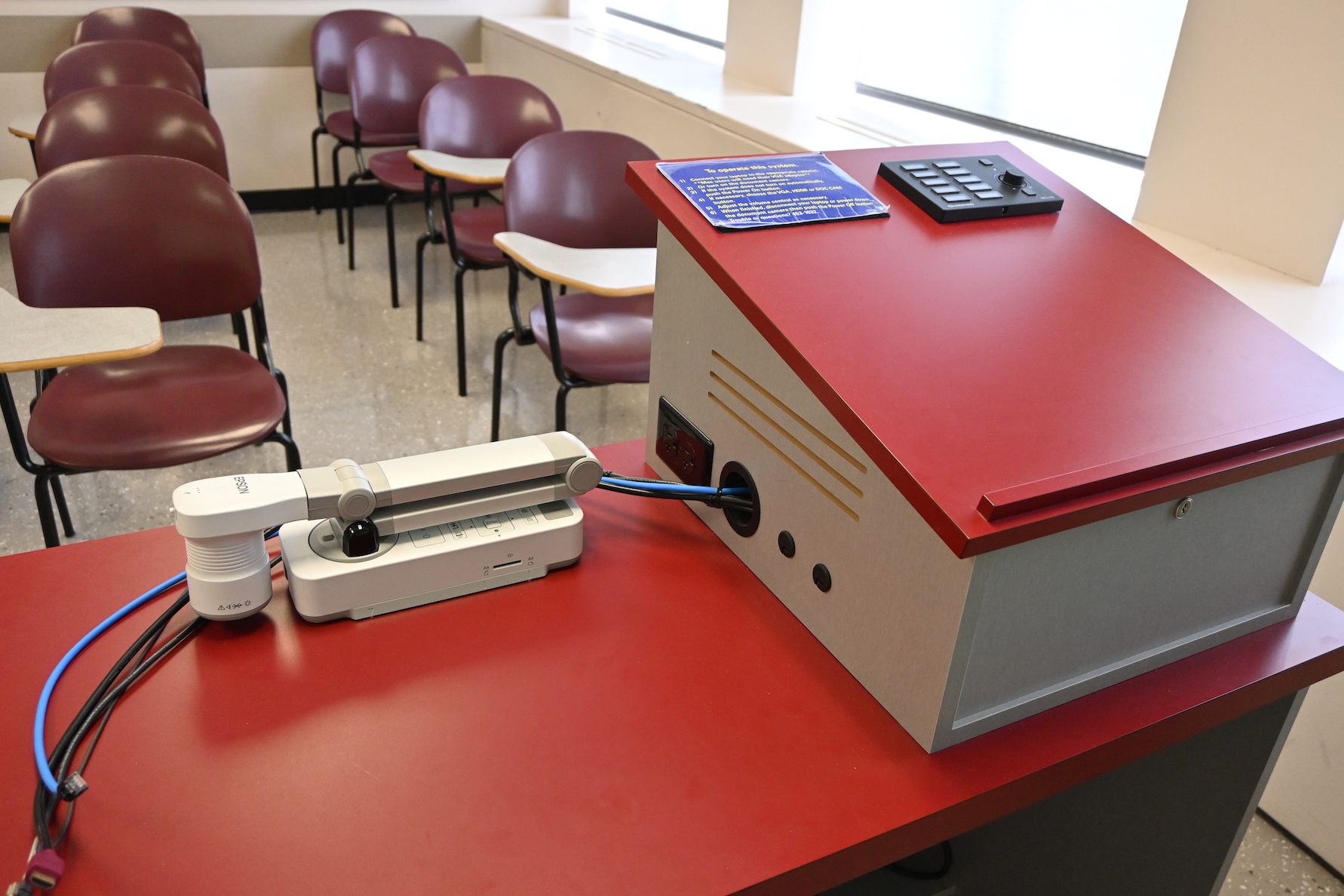 Image if the top of a podium showing document camera within an "Essential Classroom"